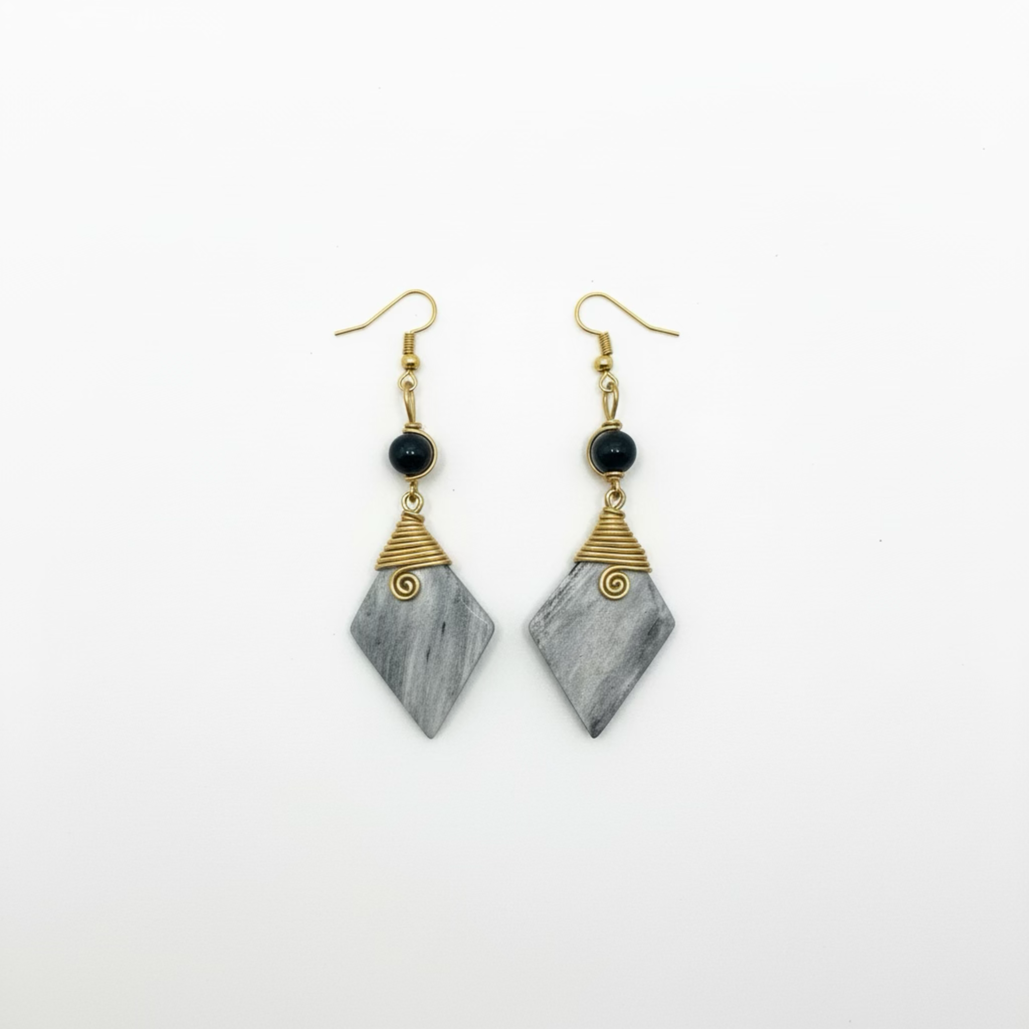 Drop earrings featuring a geometric charm with custom-shaped gemstone, grey brass metal, and lightweight design.