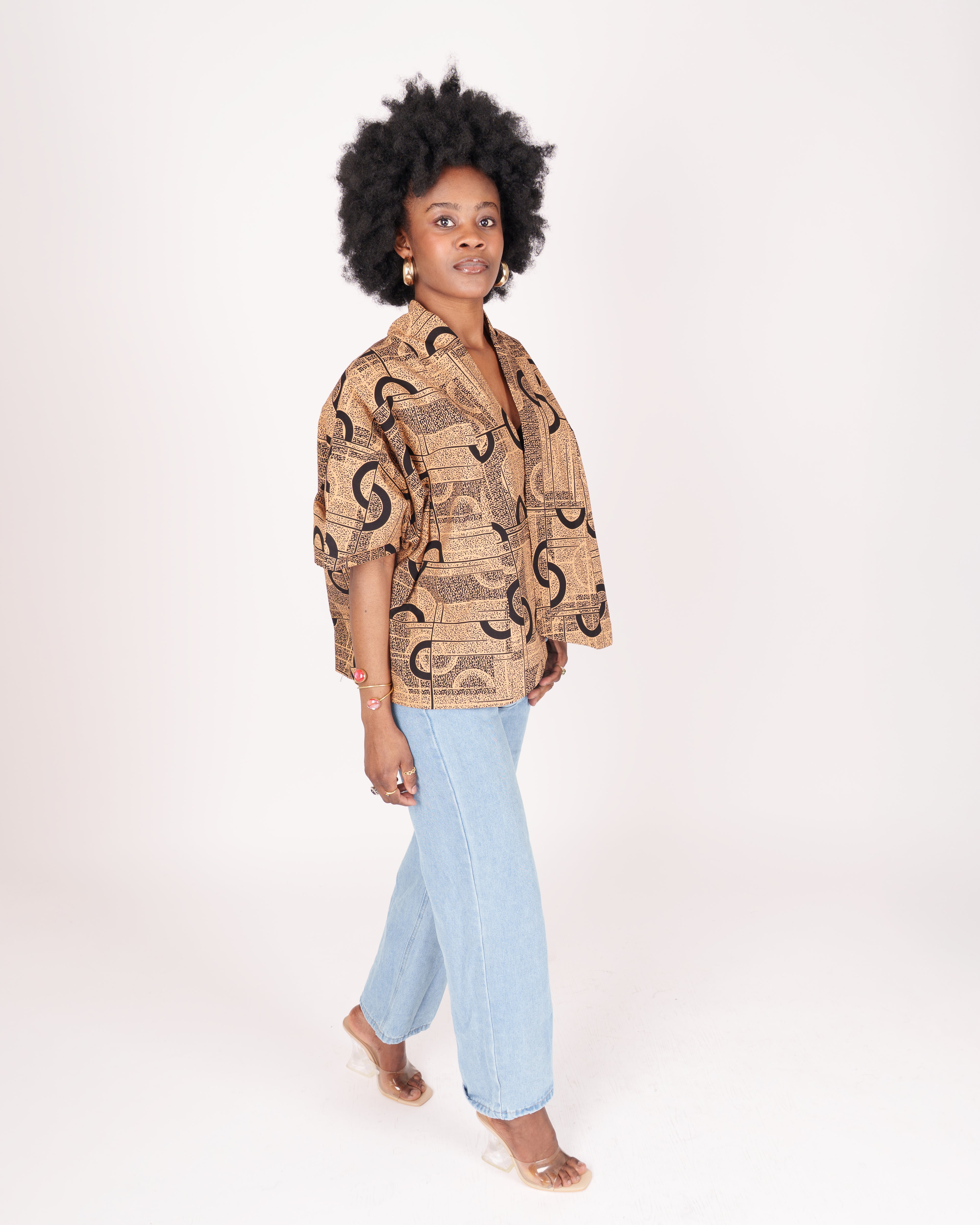 Lightweight cotton t-shirt with wide short sleeves, shirt collar, and nature-inspired abstract pattern.