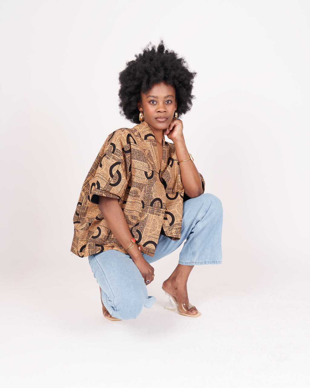 Lightweight cotton t-shirt with wide short sleeves, shirt collar, and nature-inspired abstract pattern.