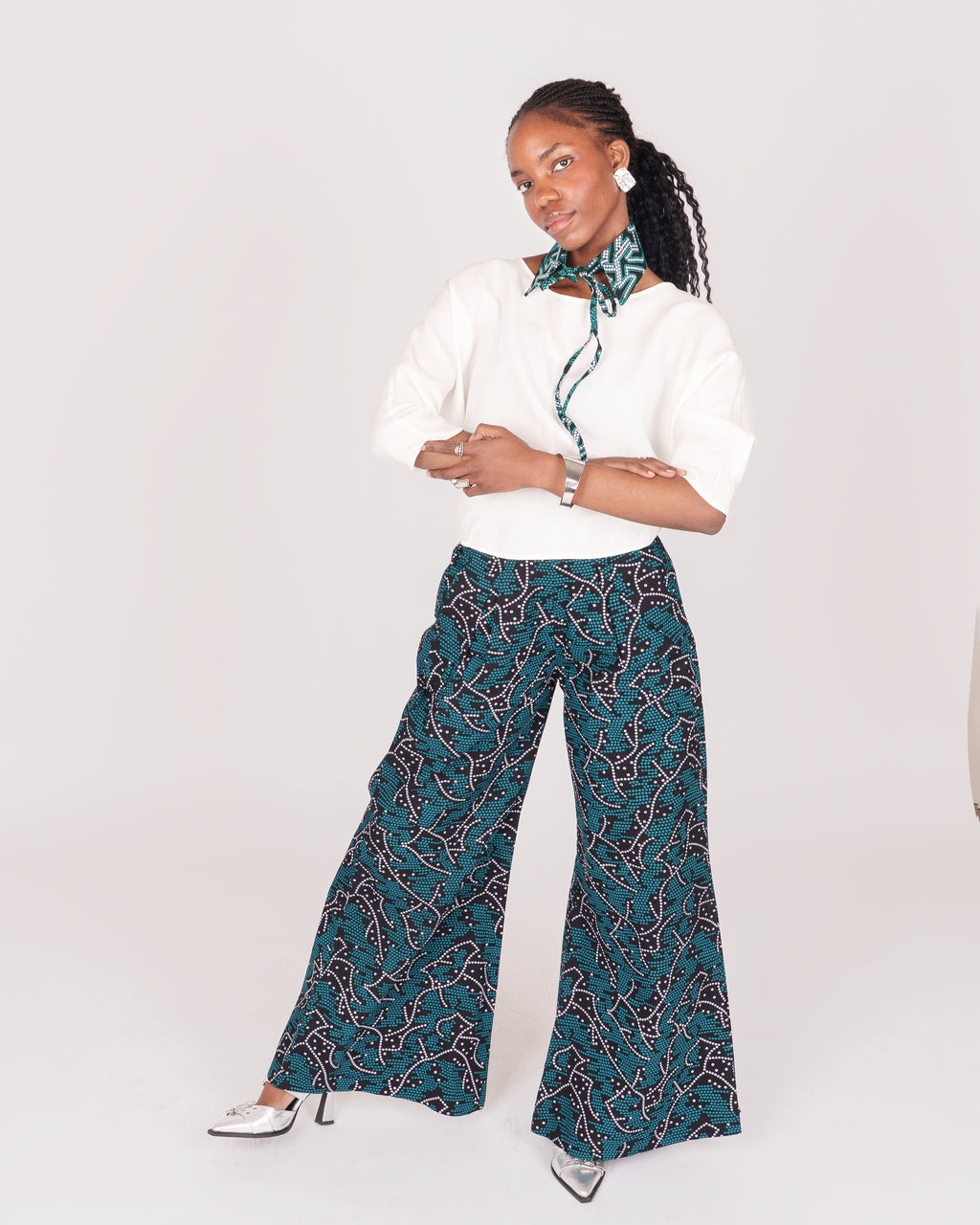 Wide leg pants featuring a fitted waist, hidden zip fly, and seam detailing for an effortlessly elegant look.