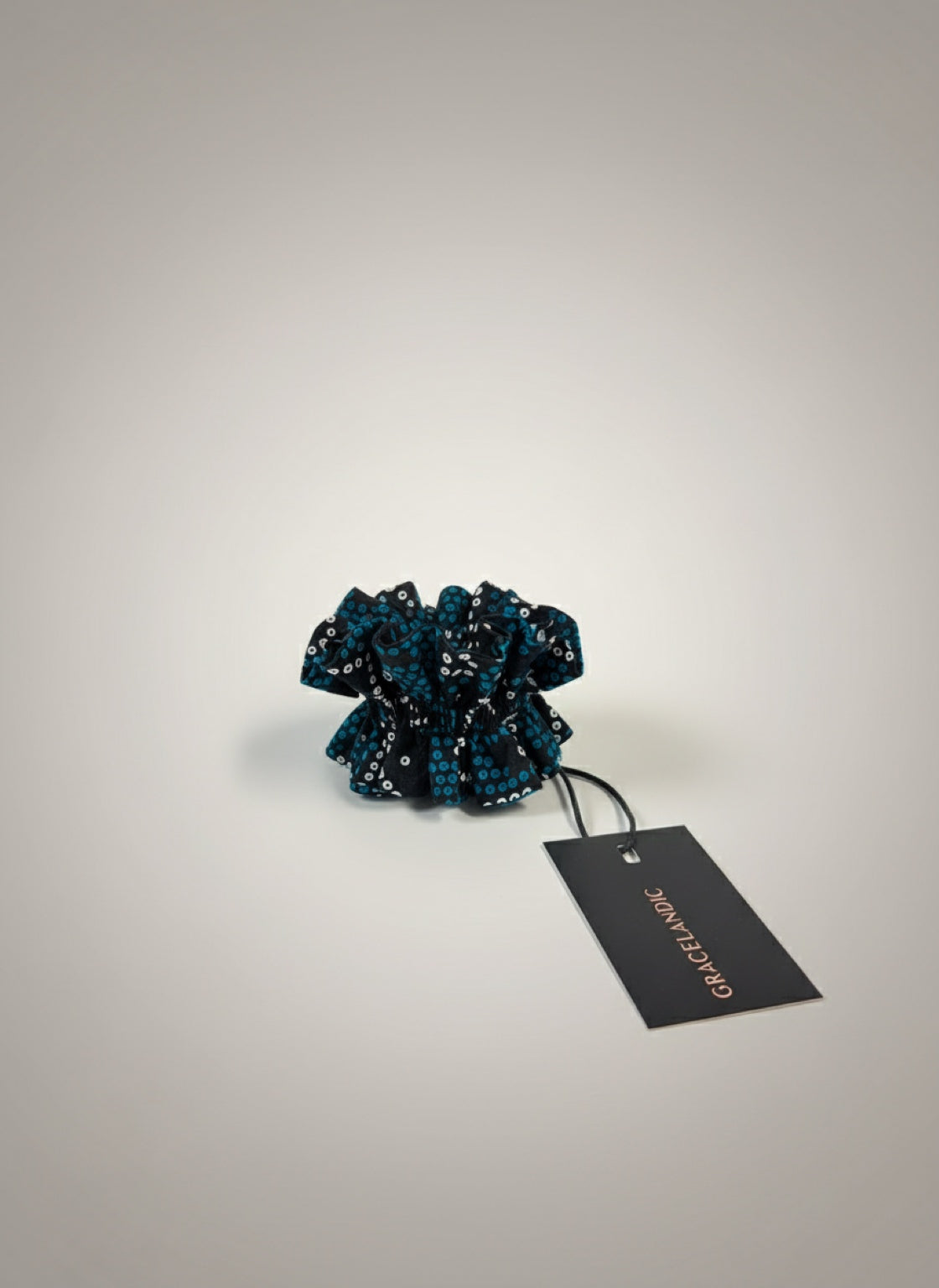 A versatile wrist band featuring an abstract pattern, designed for easy styling and movement.